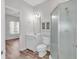 Bathroom with shower, toilet, vanity, and view of bedroom at 3943 Gladiola Ct. # 204, Myrtle Beach, SC 29588
