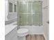 Clean bathroom with a shower/tub combo, white vanity, and linen cabinet at 3943 Gladiola Ct. # 204, Myrtle Beach, SC 29588
