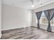 Second bedroom with hardwood floors and window at 3943 Gladiola Ct. # 204, Myrtle Beach, SC 29588