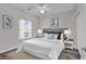 Main bedroom with hardwood floors, ceiling fan, and large window at 3943 Gladiola Ct. # 204, Myrtle Beach, SC 29588