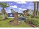 Azalea Lakes condo community entrance sign and building view at 3943 Gladiola Ct. # 204, Myrtle Beach, SC 29588