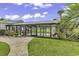 Heated, screened-in community pool with ample seating at 3943 Gladiola Ct. # 204, Myrtle Beach, SC 29588