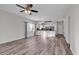 Spacious living area with hardwood floors and ceiling fan, open to kitchen at 3943 Gladiola Ct. # 204, Myrtle Beach, SC 29588