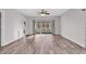 Spacious living room with wood-look floors and access to a balcony at 3943 Gladiola Ct. # 204, Myrtle Beach, SC 29588