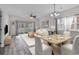 Bright and airy living room with dining area and balcony access at 3943 Gladiola Ct. # 204, Myrtle Beach, SC 29588