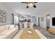 Living room with staged furniture, hardwood floors, and open layout at 3943 Gladiola Ct. # 204, Myrtle Beach, SC 29588