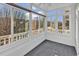 Sunroom with multiple windows, ceiling fan, and gray carpeting at 3943 Gladiola Ct. # 204, Myrtle Beach, SC 29588