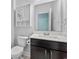 Bathroom featuring a vanity with dark cabinets, white sink, and a large mirror at 405 Cypress Springs Way, Little River, SC 29566