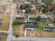Aerial view displays the home's location within a neighborhood, the roof, the driveway, and surrounding properties at 412 E Melrose St., Mullins, SC 29574