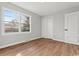 Bedroom with natural light, wood-look floors, and a closet at 412 E Melrose St., Mullins, SC 29574