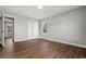 Light-filled bedroom featuring hard wood floors, a window, and spacious closet at 412 E Melrose St., Mullins, SC 29574