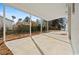 The covered patio boasts an open-air design, neutral color palette, and exterior access to the backyard at 412 E Melrose St., Mullins, SC 29574