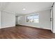 Bright living room with wood floors, fresh paint, and large window for natural lighting at 412 E Melrose St., Mullins, SC 29574
