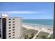 Gorgeous ocean view from condo overlooks sandy beach and sparkling coastline at 603 S Ocean Blvd. # 1002, North Myrtle Beach, SC 29582