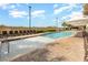 Resort-style outdoor pool with a shallow area, lounge chairs, and beach access at 603 S Ocean Blvd. # 1002, North Myrtle Beach, SC 29582