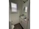 Bright bathroom featuring a vessel sink, modern fixtures, and a window with natural light at 128 Fulbourn Pl., Myrtle Beach, SC 29579