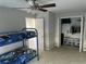 A bedroom with a bunk bed and closet storage, perfect for a growing Gathering at 128 Fulbourn Pl., Myrtle Beach, SC 29579