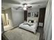Inviting bedroom featuring a patterned rug, wall decor, and a comfortable bed with decorative pillows at 128 Fulbourn Pl., Myrtle Beach, SC 29579