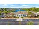 Aerial view of the community clubhouse with parking, set against a scenic lake backdrop at 128 Fulbourn Pl., Myrtle Beach, SC 29579