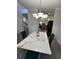 Dining area with marble table, chandelier, and views of both the kitchen and entryway at 128 Fulbourn Pl., Myrtle Beach, SC 29579