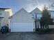 Charming two-story home with a two car garage in a residential neighborhood on a sunny day at 128 Fulbourn Pl., Myrtle Beach, SC 29579