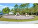 Community playground featuring multiple slides and play structures in a wood-mulched play area at 128 Fulbourn Pl., Myrtle Beach, SC 29579