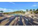 Inviting community pool with lounge chairs, umbrellas, and a surrounding landscape at 128 Fulbourn Pl., Myrtle Beach, SC 29579