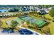 Aerial view of community tennis courts and basketball court surrounded by landscaped grounds and residential homes at 128 Fulbourn Pl., Myrtle Beach, SC 29579