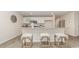 Eat-in kitchen featuring a granite countertop island with seating and bright cabinetry at 218 Carver Willow Dr., Loris, SC 29569