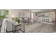 Stylish living room with a view of the kitchen and breakfast bar with seating at 218 Carver Willow Dr., Loris, SC 29569