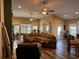 Spacious living room with a large sofa, ceiling fans, and lots of natural light from large windows at 225 Coachman Dr., Pawleys Island, SC 29585