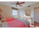 Charming bedroom featuring two twin beds, a ceiling fan, closet, and wood-look floors at 300 63Rd Ave. N # 306-C, North Myrtle Beach, SC 29582