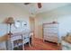 Comfortable room featuring a wood desk, dresser, and hardwood floors at 300 63Rd Ave. N # 306-C, North Myrtle Beach, SC 29582