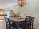 Well-lit dining area with traditional chandelier and kitchen access at 300 63Rd Ave. N # 306-C, North Myrtle Beach, SC 29582