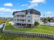 Multi-story beach house with multiple balconies, a pool, and outdoor entertaining area at 300 63Rd Ave. N # 306-C, North Myrtle Beach, SC 29582