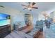 Spacious living room with TV, cozy furniture, and open access to dining area at 300 63Rd Ave. N # 306-C, North Myrtle Beach, SC 29582