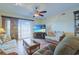 Inviting living room featuring cozy furnishings and a sliding glass door leading to the balcony at 300 63Rd Ave. N # 306-C, North Myrtle Beach, SC 29582