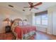 Relaxing main bedroom featuring a large window with scenic views and hardwood floors at 300 63Rd Ave. N # 306-C, North Myrtle Beach, SC 29582