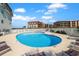 Outdoor swimming pool with lounge chairs at 300 63Rd Ave. N # 306-C, North Myrtle Beach, SC 29582
