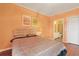 Comfortable bedroom with a large bed, a small lamp, and an ensuite bathroom with a shower and toilet at 4240 Coquina Harbour Dr. # E-4, Little River, SC 29566