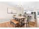 Dining area with wood table and bench, adjacent to kitchen at 4648 Livorn Loop # 2628, Myrtle Beach, SC 29579