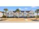 Tan two-story townhome with a front yard and walkway at 4648 Livorn Loop # 2628, Myrtle Beach, SC 29579