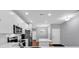 Bright kitchen features white cabinets and hardwood floors at 736 Salerno Circle # D, Myrtle Beach, SC 29579