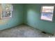 Bright bedroom with two windows and light-green walls at 807 Anne St., North Myrtle Beach, SC 29582