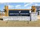 Heritage Crossing community sign featuring stone accents and wood posts against a blue sky at 835 Buttonwood Dr., Conway, SC 29527