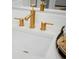 Close up on modern, sleek gold faucet in stylish bathroom at 8476 Duke Pl. # 32, Myrtle Beach, SC 29572