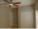 Bright bedroom featuring a ceiling fan, closet, and neutral walls at 941 Hickman Rd., Tabor City, NC 28463