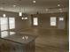 Spacious open-concept living area featuring recessed lighting and large windows at 941 Hickman Rd., Tabor City, NC 28463