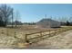 A view of the home's spacious front and side yard with a newly installed fence at 941 Hickman Rd., Tabor City, NC 28463