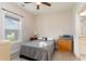 Cozy bedroom with natural light, featuring a comfortable bed and hardwood floors at 109 S Shore Blvd. # 104, Longs, SC 29568
